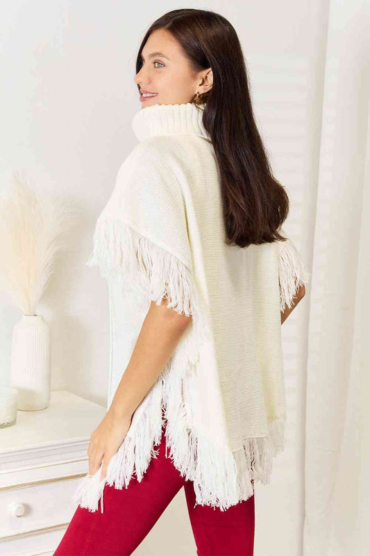 Justin Taylor Turtle Neck Fringe Poncho Luvéillé
