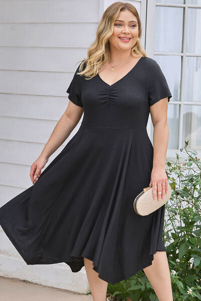 Plus Size Ruched Crisscross V-Neck Short Sleeve Dress Luvéillé