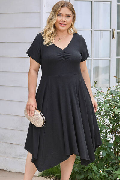 Plus Size Ruched Crisscross V-Neck Short Sleeve Dress Luvéillé