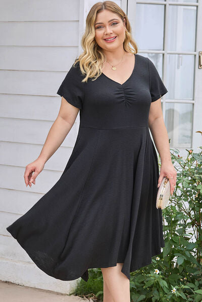 Plus Size Ruched Crisscross V-Neck Short Sleeve Dress Luvéillé