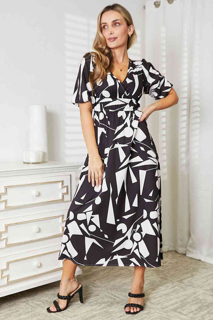 Double Take Printed Surplice Balloon Sleeve Dress Luvéillé