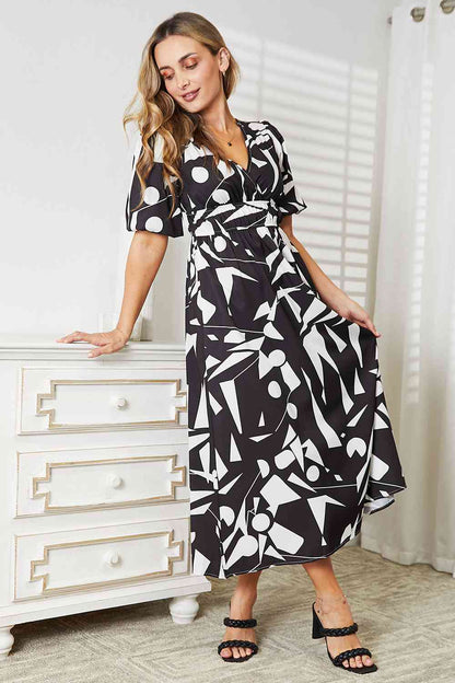 Double Take Printed Surplice Balloon Sleeve Dress Luvéillé